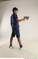 TIMBO STANDING POSE WITH GUN